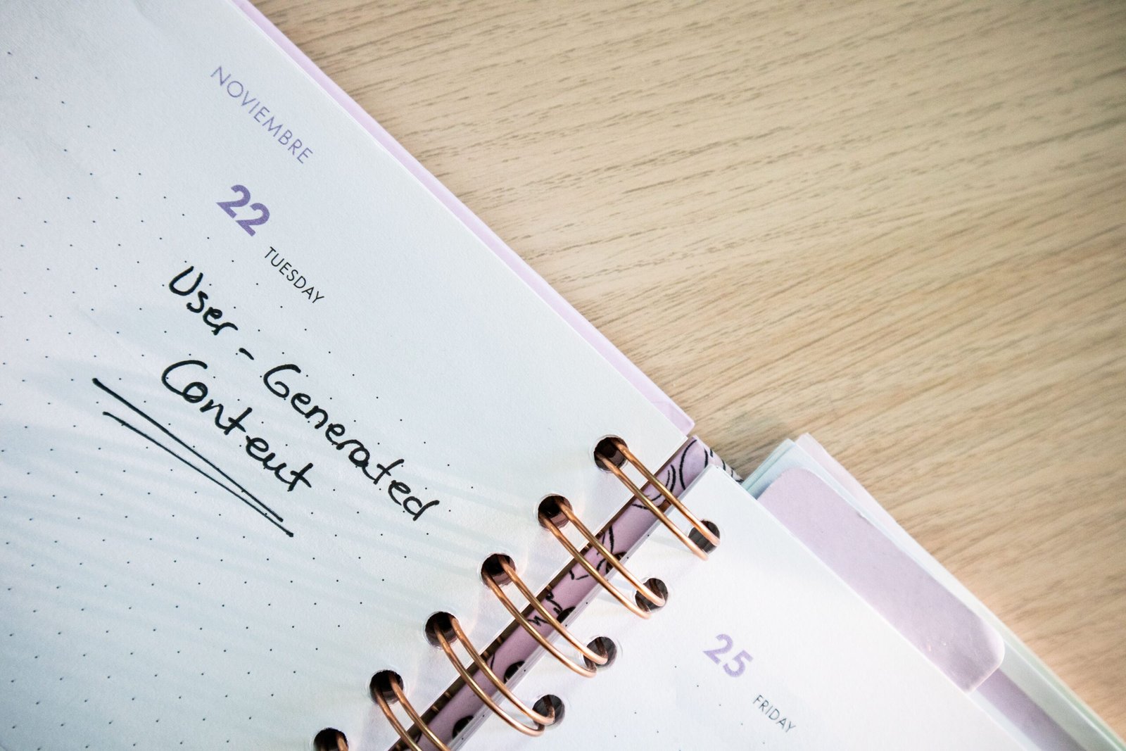 Open planner with handwritten notes on a desk, representing a scheduled employee handbook review